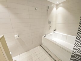 Luxury Room | Bathroom | Combined shower/tub, deep soaking tub, hair dryer, bathrobes