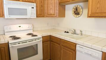 Suite, 1 Bedroom | Private kitchen | Fridge, microwave, oven, stovetop