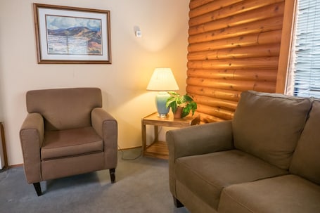 Cabin, 1 Bedroom | Living area | Flat-screen TV. Whispering Pines