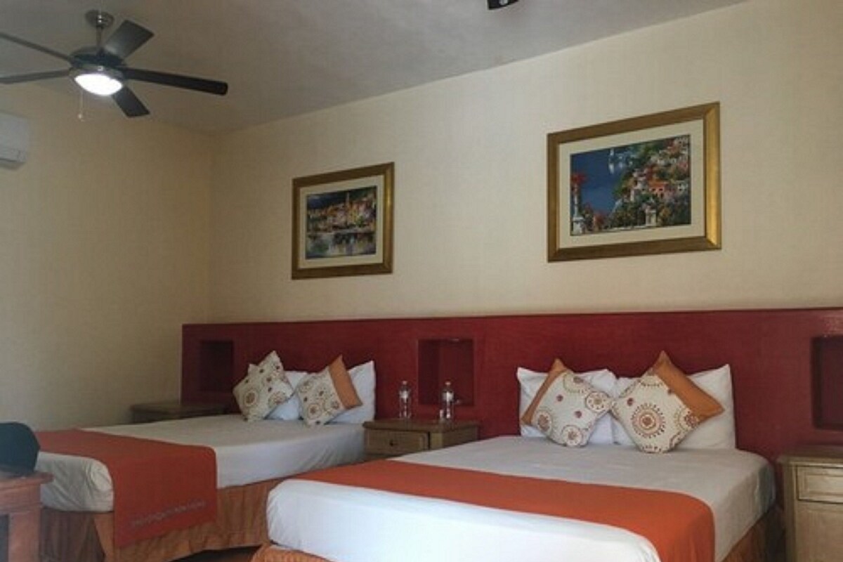 Quarto standard | Cortinas blackout, Wi-Fi de cortesia, roupa de cama