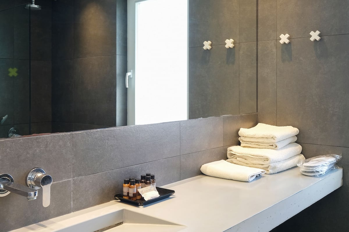superior suite, jetted tub | bathroom | shower, rainfall showerhead, eco-friendly toiletries, hair dryer