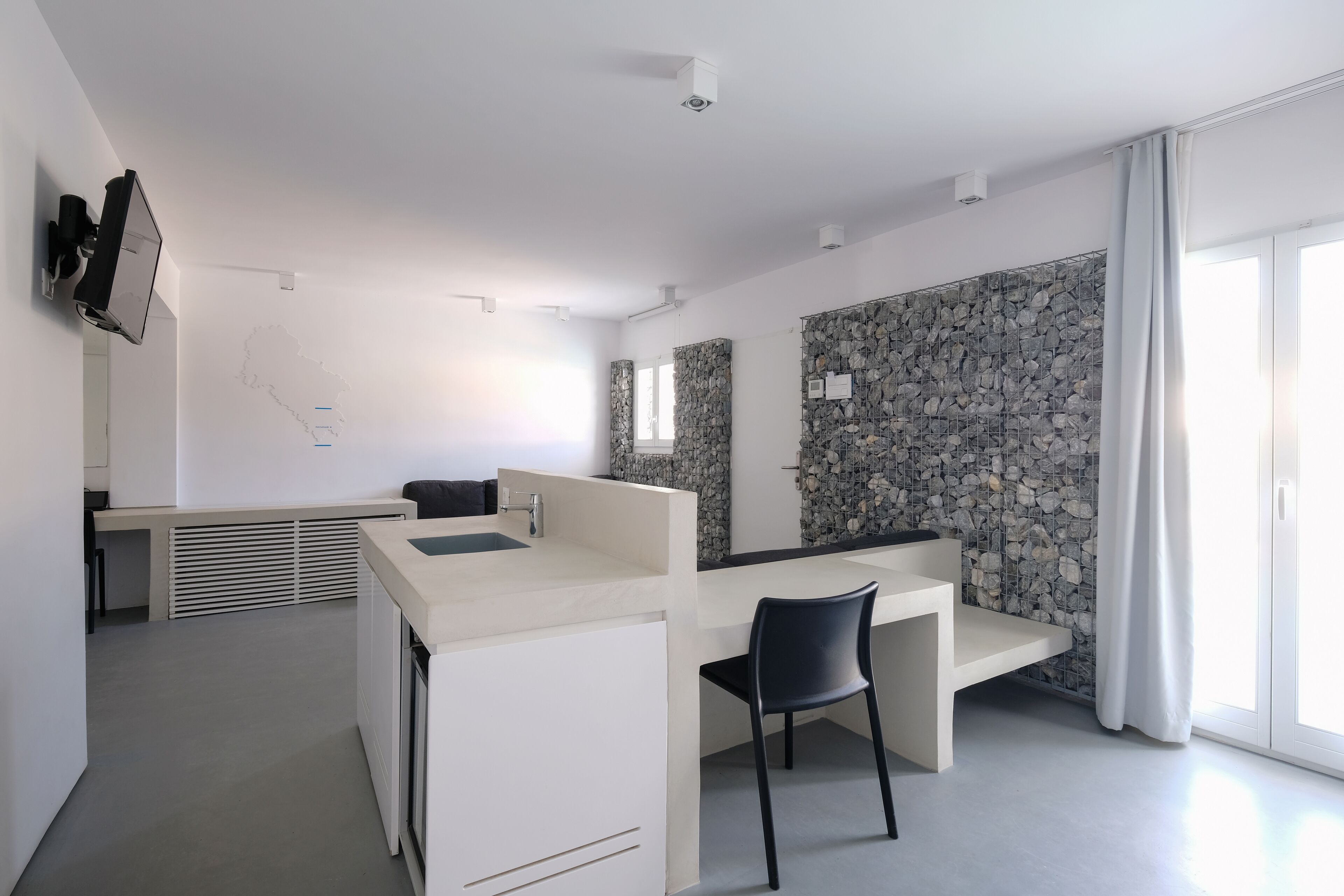 junior suite, private pool | living area | 32-inch flat-screen tv with satellite channels, tv, tablet