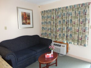 Habitación, 1 cama de matrimonio grande con sofá cama | Zona de estar