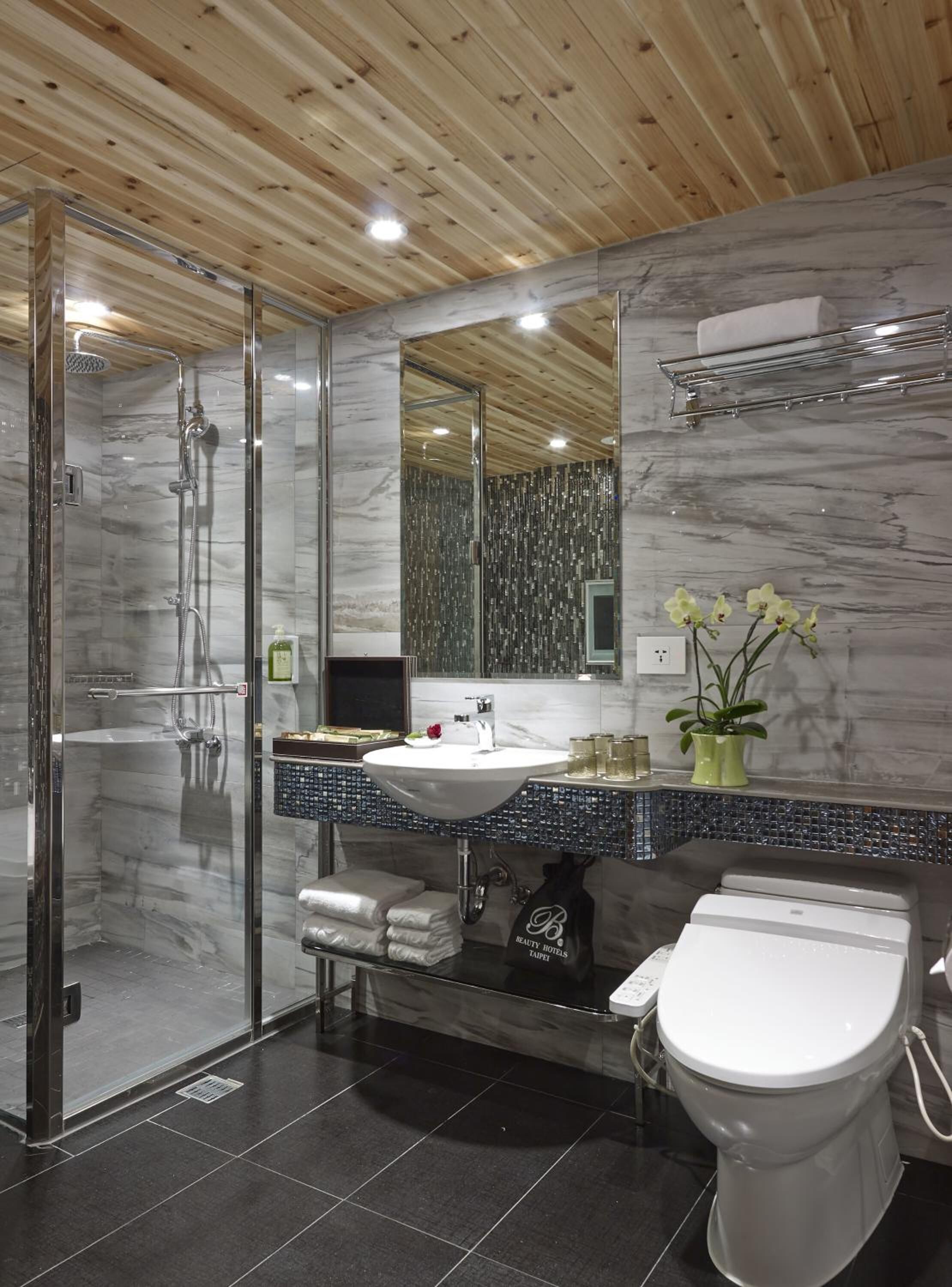 hair dryer, slippers, bidet, towels