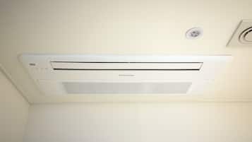 A Samsung air conditioning unit mounted on a white ceiling.