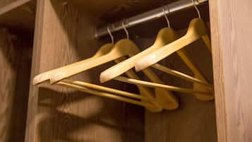 Wooden hangers in a closet.