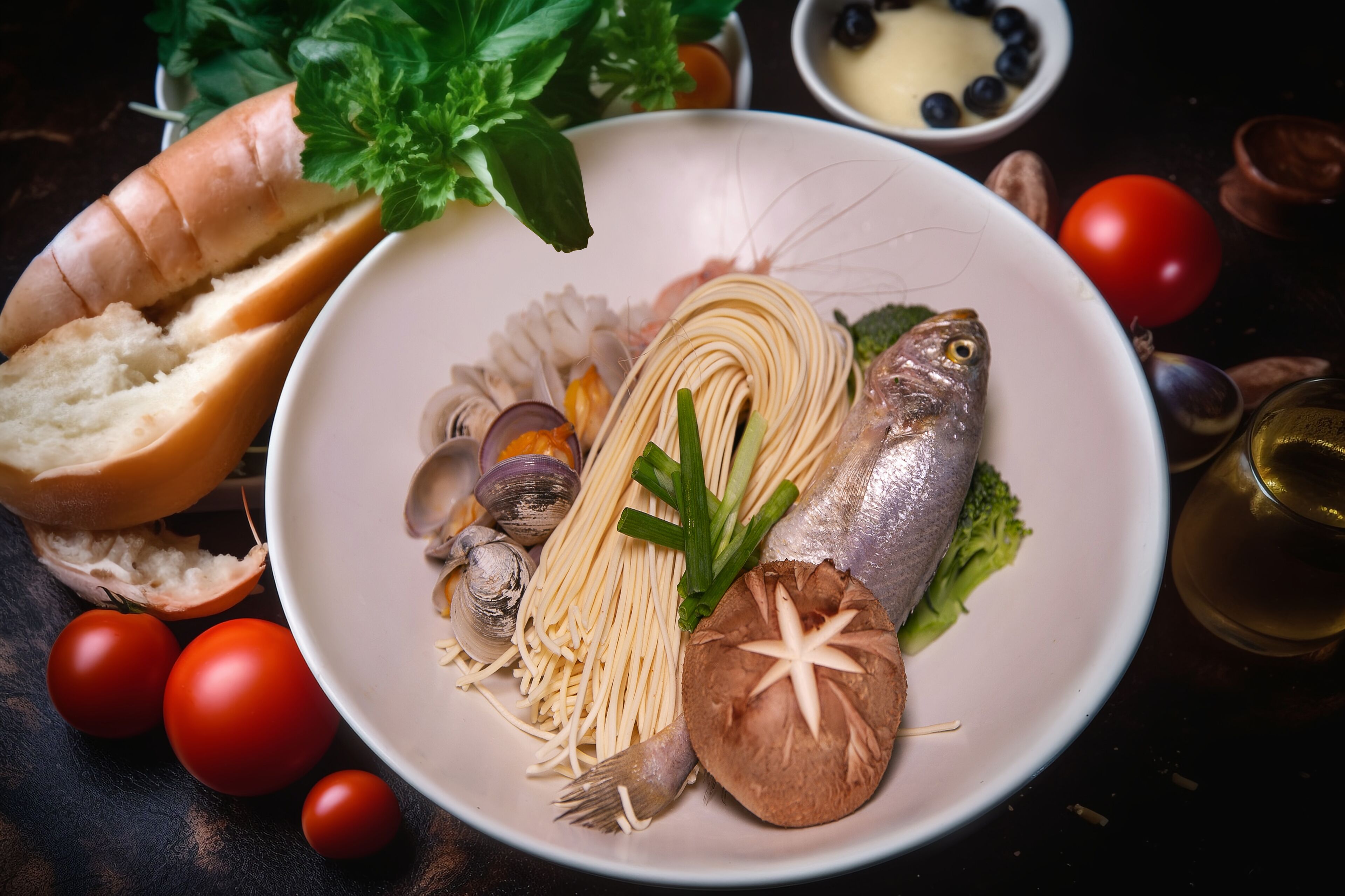 A plate of food with various ingredients like fish, mushrooms, and vegetables.