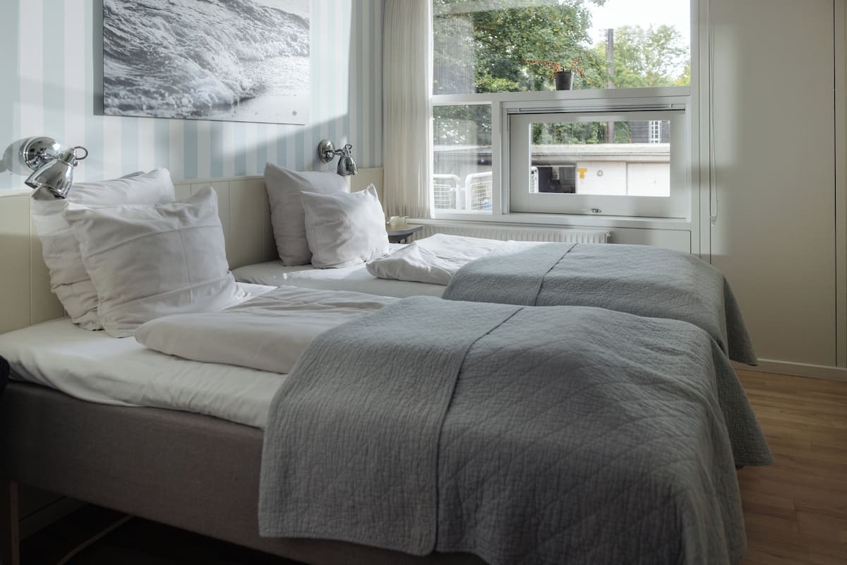 basic double room, 2 single beds | hypo-allergenic bedding, desk, iron/ironing board, cots/infant beds