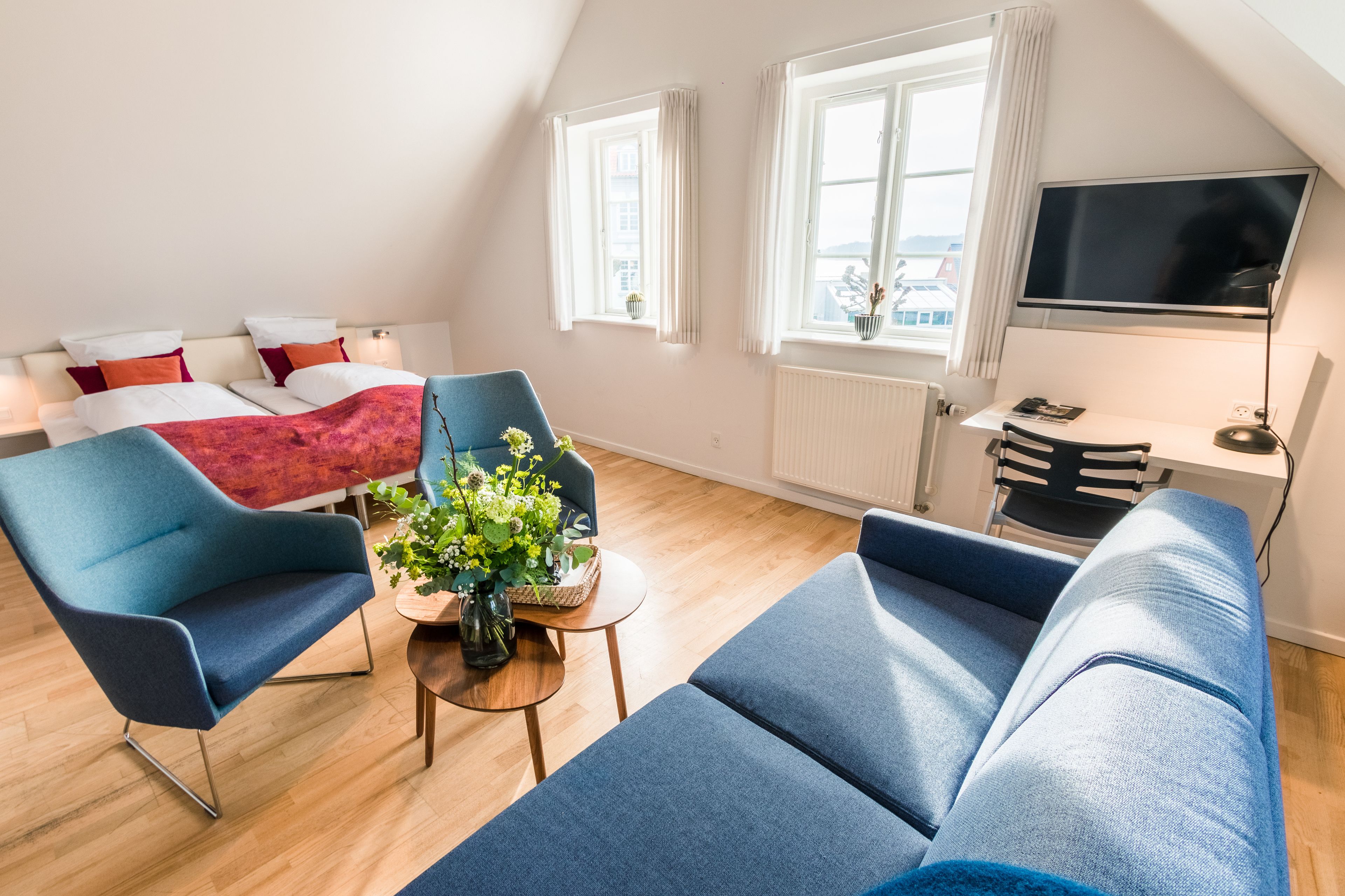 family room | premium bedding, desk, laptop workspace, soundproofing