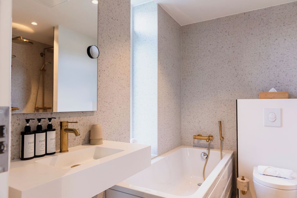 designer toiletries, hair dryer, heated floors, towels