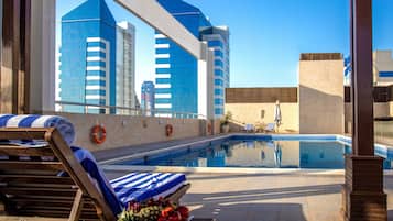 Outdoor pool, open 9 AM to 6 PM, free cabanas, pool umbrellas