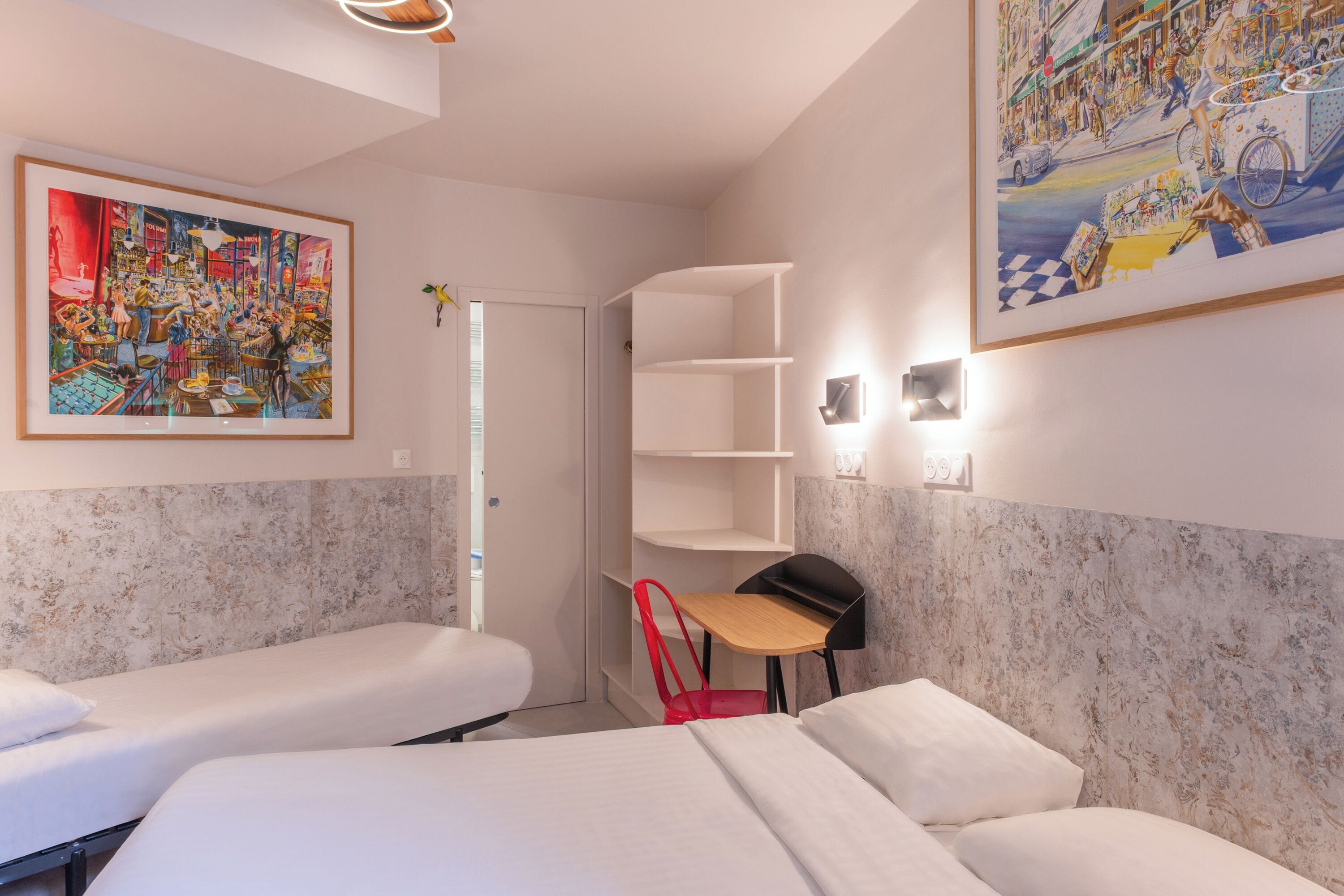 A hotel room with two beds, a desk, a chair, and a large painting on the wall.