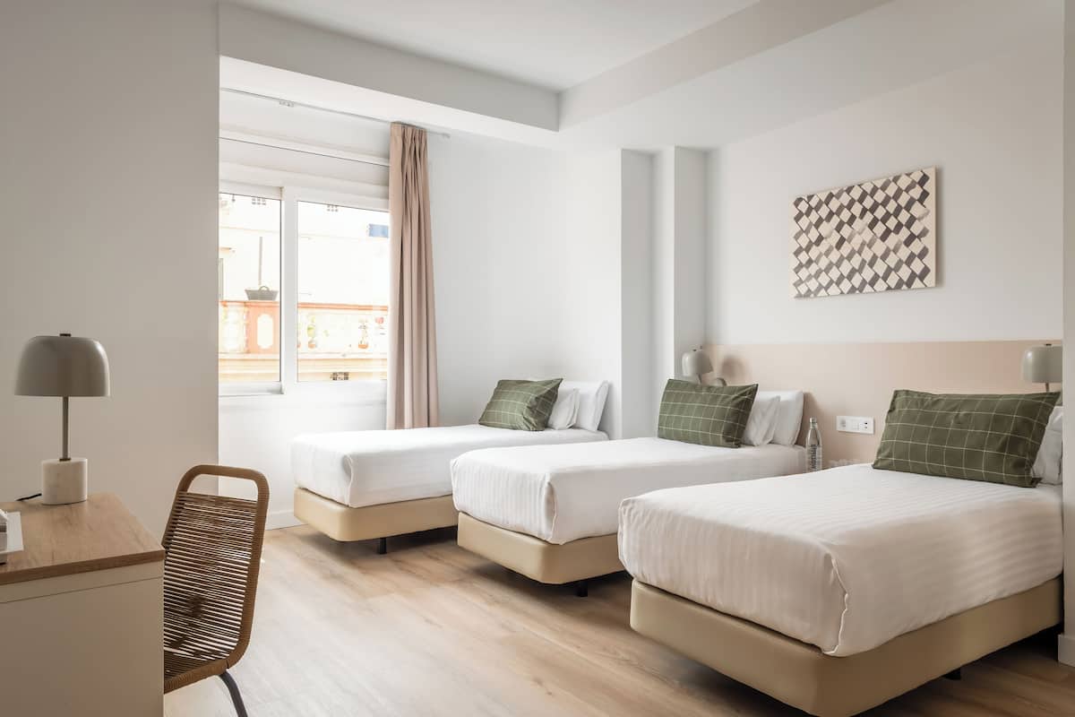 Triple Room | In-room safe, blackout drapes, free cribs/infant beds, rollaway beds