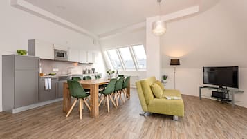 Deluxe Penthouse, Balcony | Living area | 42-inch LED TV with digital channels, TV, iPad