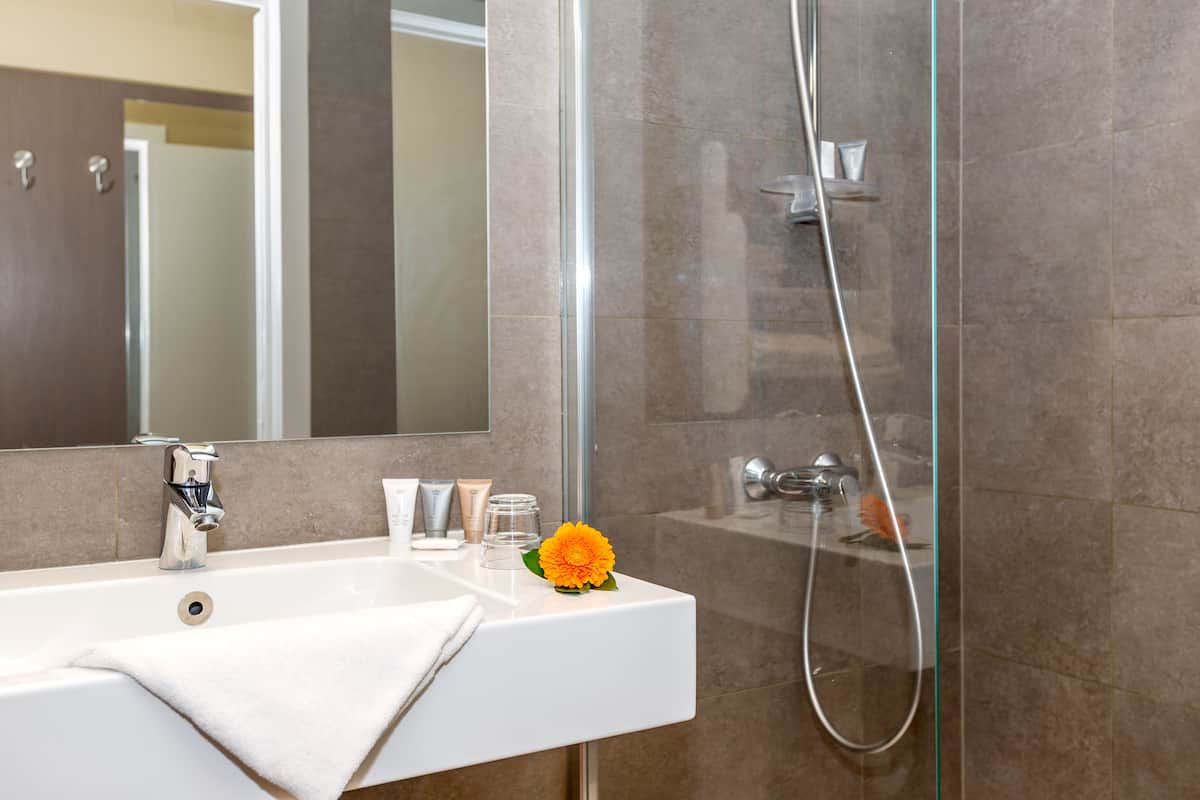 superior twin room | bathroom | free toiletries, hair dryer, towels