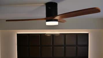 A ceiling fan with a wooden blade and a light fixture.