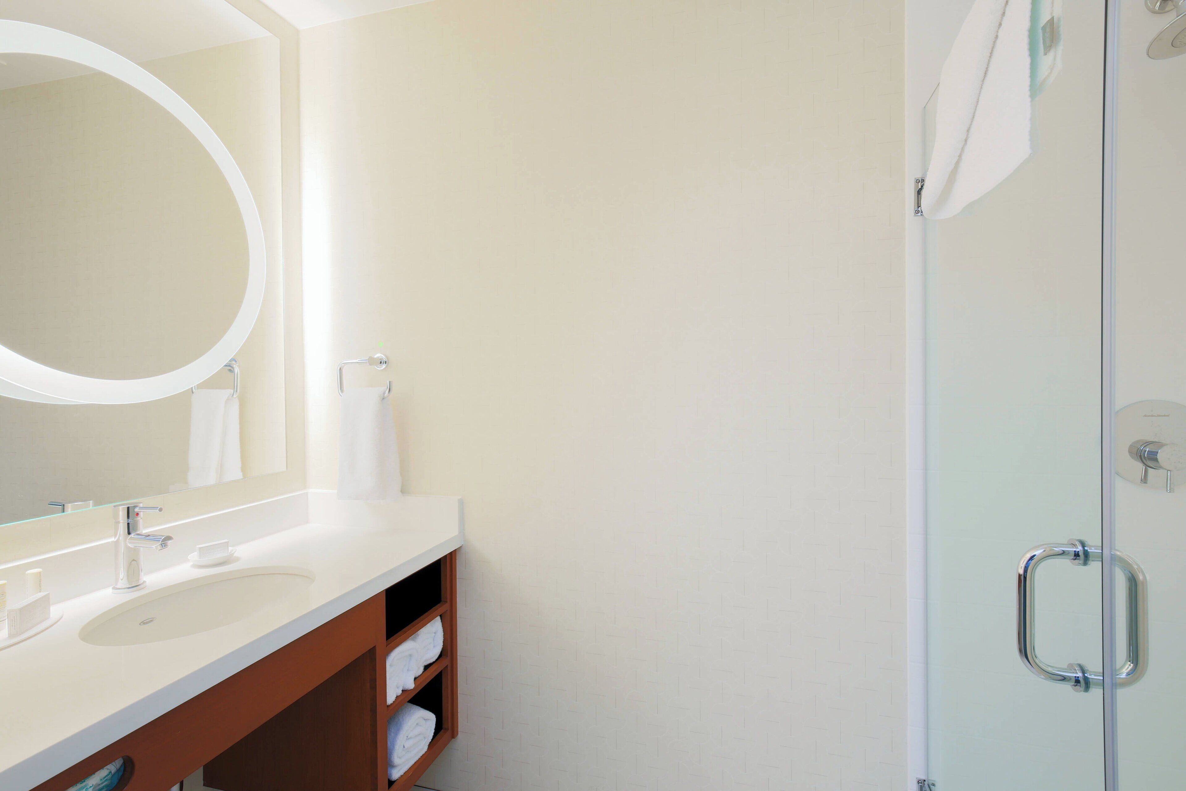 shower, designer toiletries, hair dryer, towels