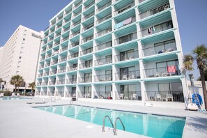 Seasonal outdoor pool, open 9:00 AM to 10:00 PM, pool umbrellas - Tropical Seas Hotel (Myrtle Beach)