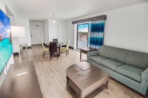 Oceanfront Queen Penthouse (no pets) | Living area | 50-inch flat-screen TV with cable channels, TV - Tropical Seas Hotel (Myrtle Beach)