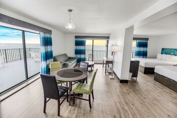 Oceanfront Queen Penthouse (no pets) | Living area | 50-inch flat-screen TV with cable channels, TV at Tropical Seas Hotel