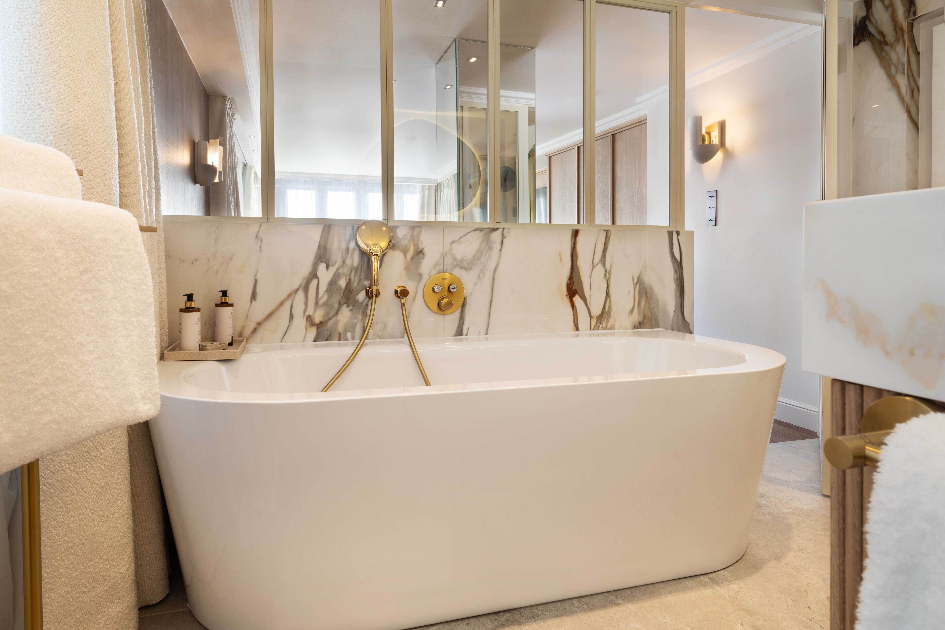 signature suite | bathroom | designer toiletries, hair dryer, bathrobes, slippers