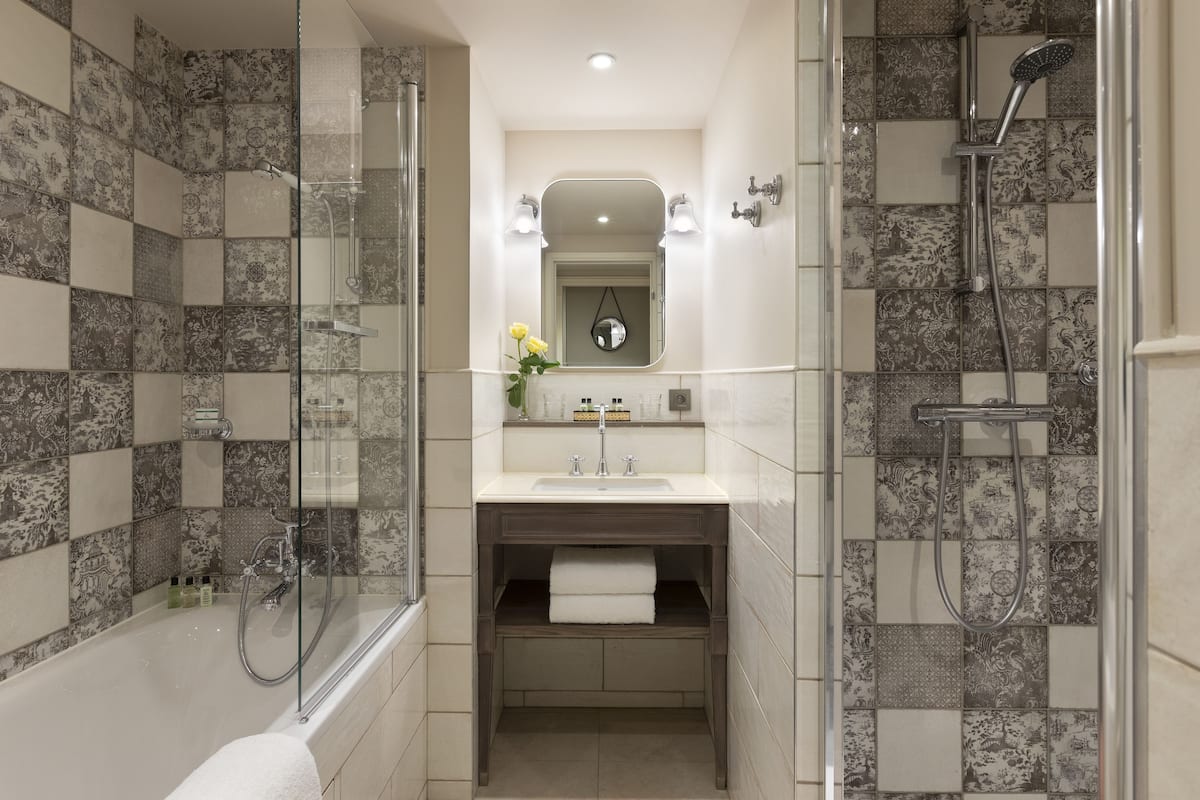 Exclusive Suite | Bathroom | Designer toiletries, hair dryer, bathrobes, slippers