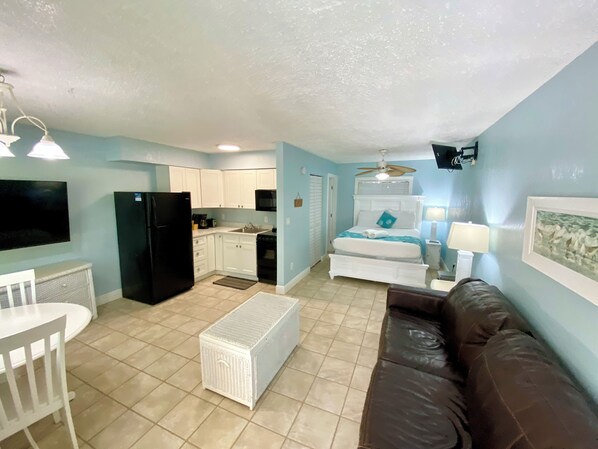 Studio Apartment Units #9 & #9a (at White Sands) | Living area | 42-inch LCD TV with cable channels, TV, video-game console