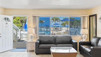 Pool Front Beach View 2 Bedroom 2 Bath Unit #14 (at White Sands) | Living area | 42-inch LCD TV with cable channels, TV, video game console