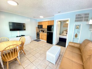 Small 1 Bedroom Apartment Unit #7 (at White Sands) | Living area | 42-inch LCD TV with cable channels, TV, video-game console