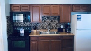 Beachfront 1 Bedroom Deluxe Units #11 & #12 (at White Sands) | Private kitchen | Full-size fridge, microwave, oven, stovetop