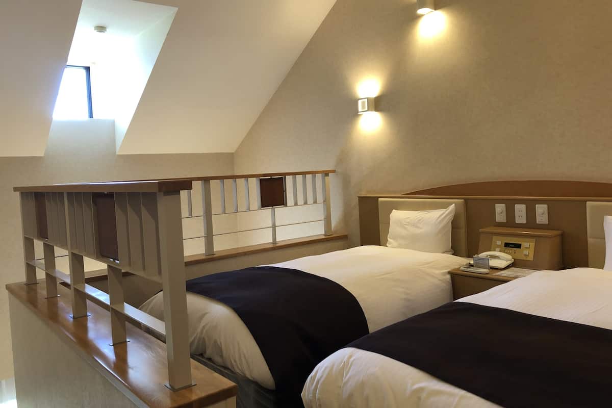 Kahden hengen huone (kaksi sänkyä), vuoristonäköala | 2 makuuhuonetta, ylelliset vuodevaatteet, tallelokero huoneessa