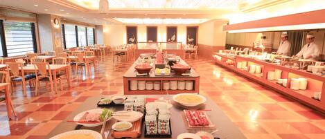 A buffet setup with various dishes and a long counter.
