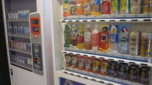 A vending machine with various beverages and snacks.