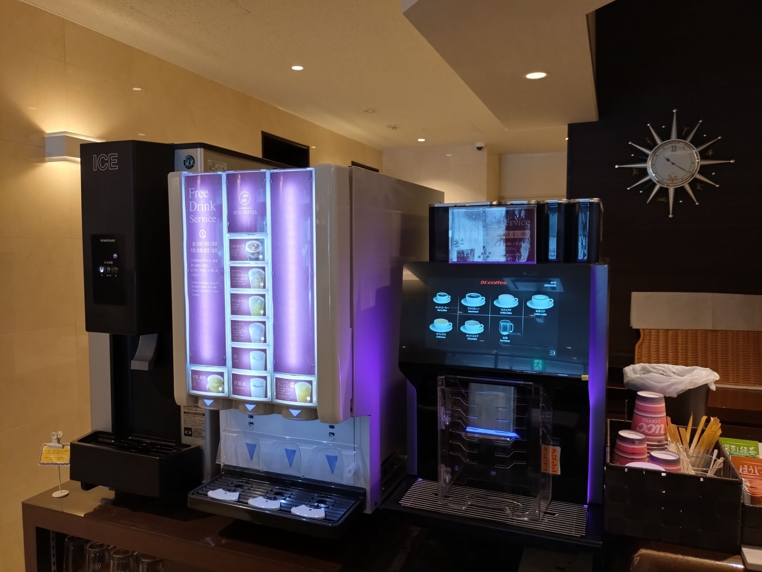 A coffee machine with a digital display and a selection of beverages.