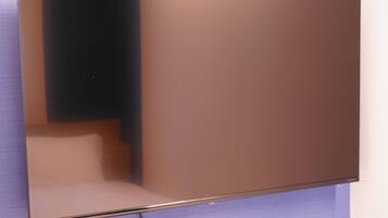 A flat-screen TV mounted on a wall.