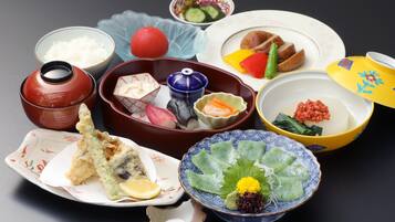 A variety of traditional Japanese dishes arranged on a table.