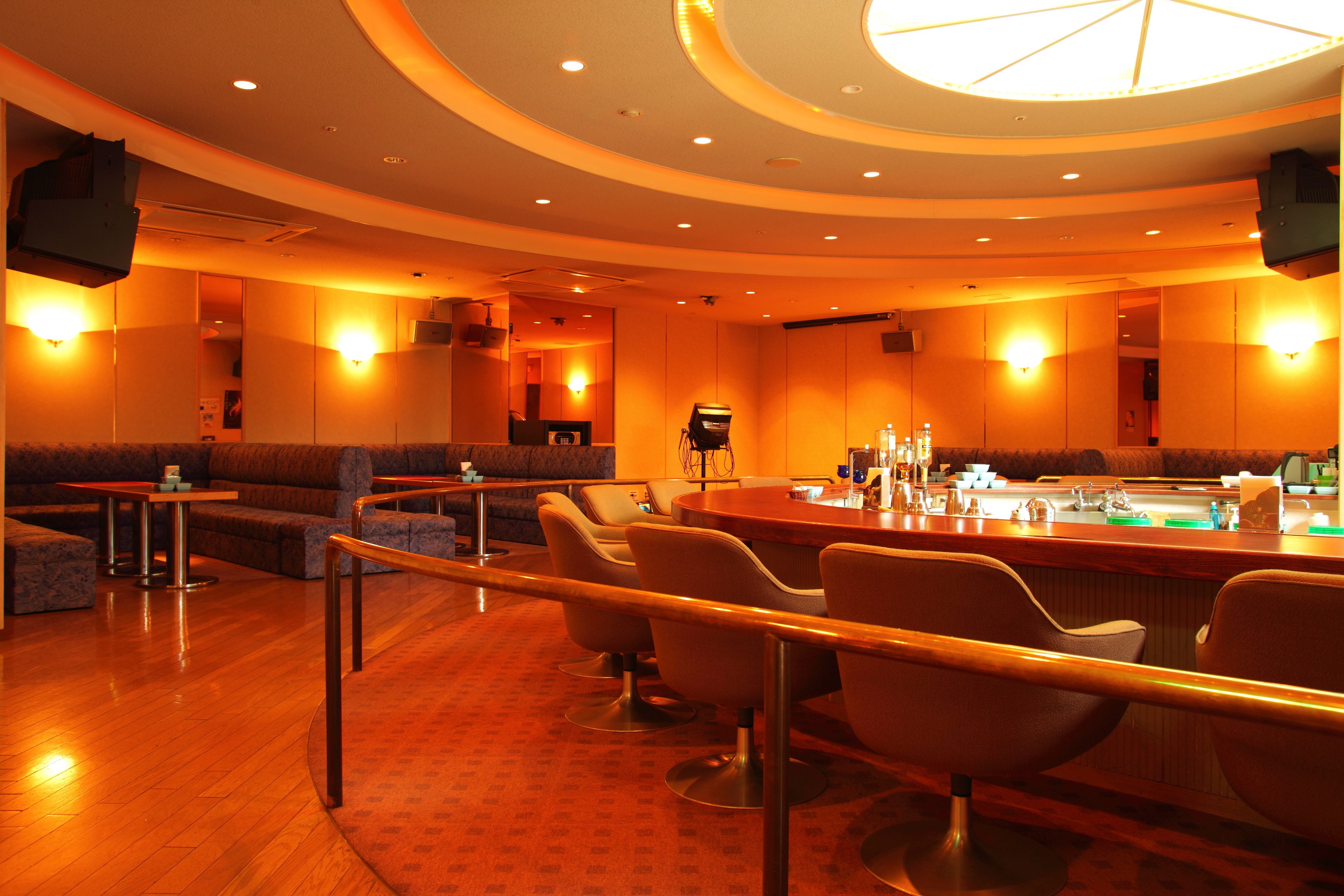 A bar area with seating and a counter.