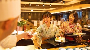 A restaurant interior with a modern design, featuring a counter and seating area. - Ooedo Onsen Monogatari Awara (Awara)