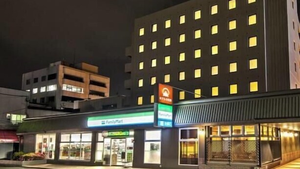 A multi-story hotel with a FamilyMart convenience store on the ground floor. - Hotel Odashima (Morioka)
