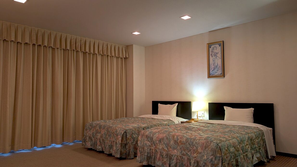 A hotel room with two beds, a large window with curtains, a painting on the wall, and a nightlight.