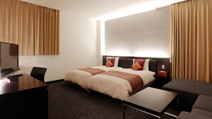 A hotel room with a bed, a desk, a chair, a TV, and curtains. - Muroran Prince Hotel (Muroran)
