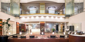 A hotel lobby with a reception desk, seating area, and a chandelier. - Utsunomiya Tobu Hotel Grande (Utsunomiya)