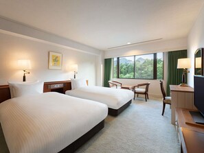 Deluxe Suite, Multiple Beds | Down comforters, in-room safe, desk, soundproofing