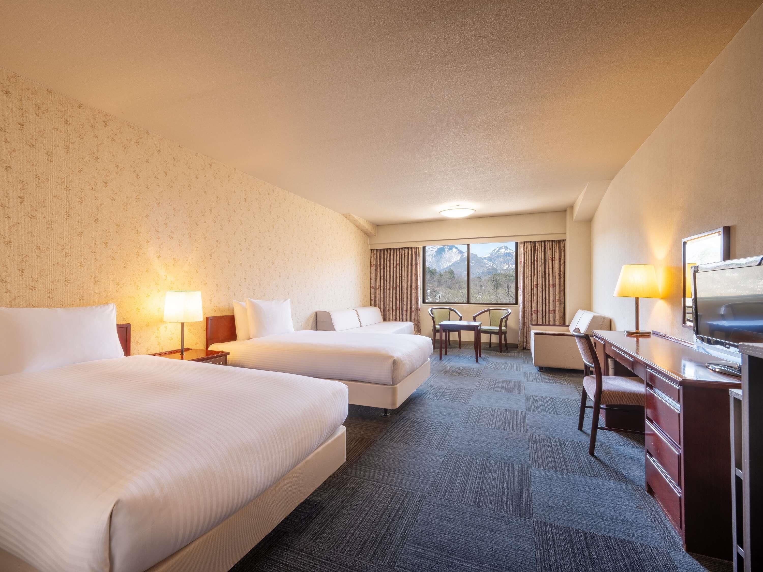 Classic Room with 2 single beds and 2 sofa beds | Down comforters, in-room safe, desk, soundproofing