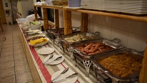A buffet line with various food items and utensils. - Hotel Crown Hills Toyokawa (Toyokawa)