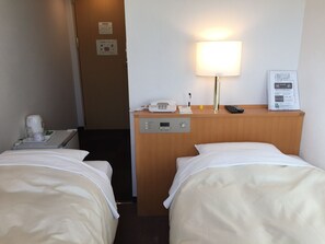 Economy Twin Room, Non Smoking | Blackout drapes, iron/ironing board, free WiFi, bed sheets