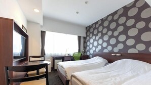 A hotel room with two beds, a desk, a chair, a television, and a window with curtains. - Just ONE (Susono)
