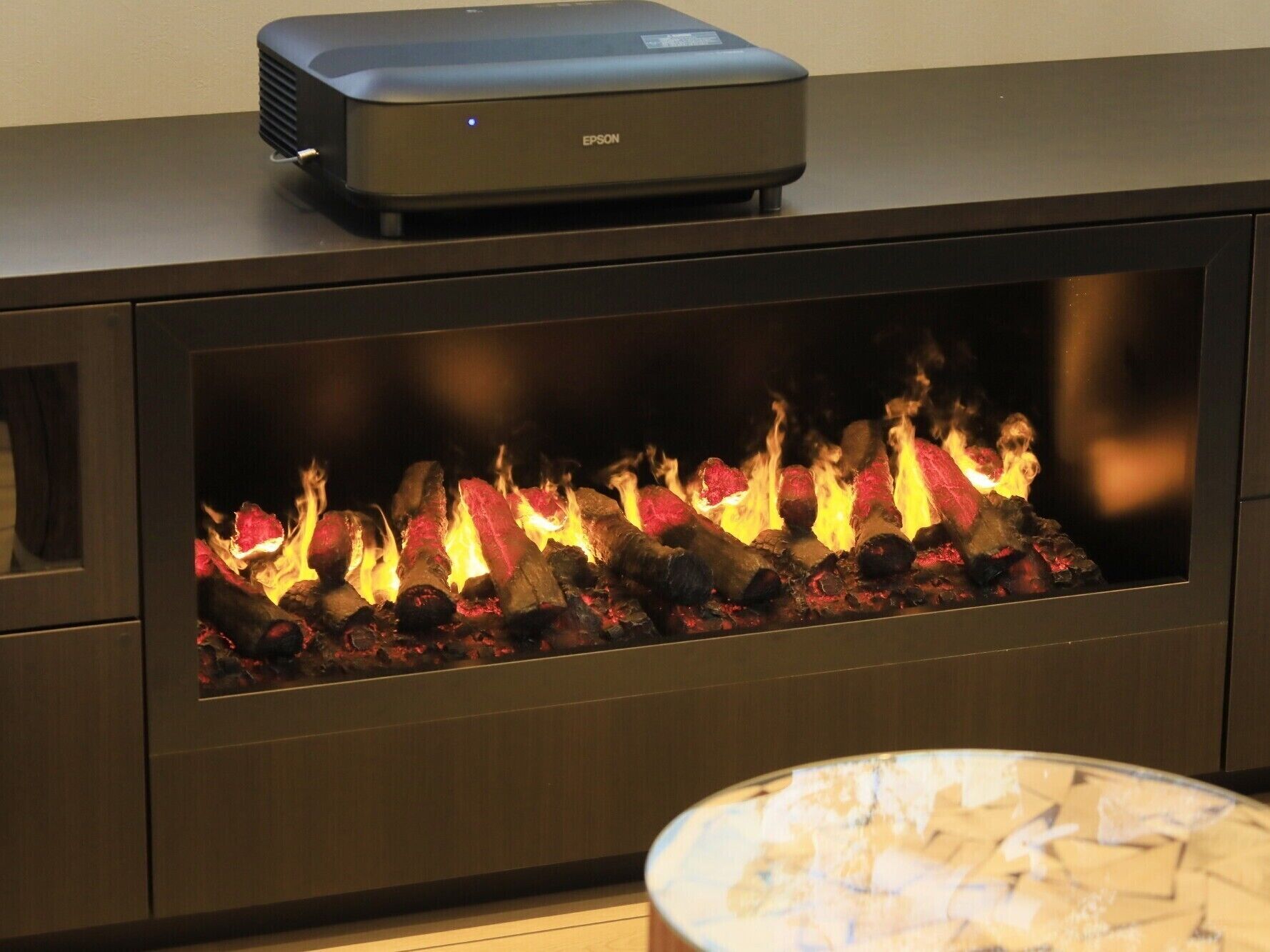 A modern fireplace with a built-in entertainment system.
