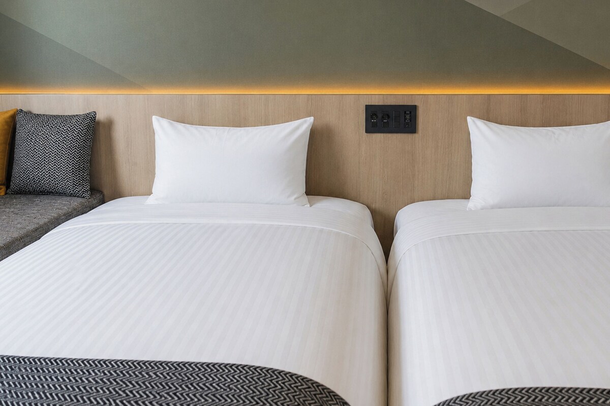 Pillow-top beds, desk, laptop workspace, blackout curtains