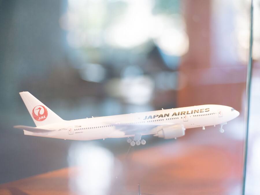 A model airplane with the Japan Airlines logo.